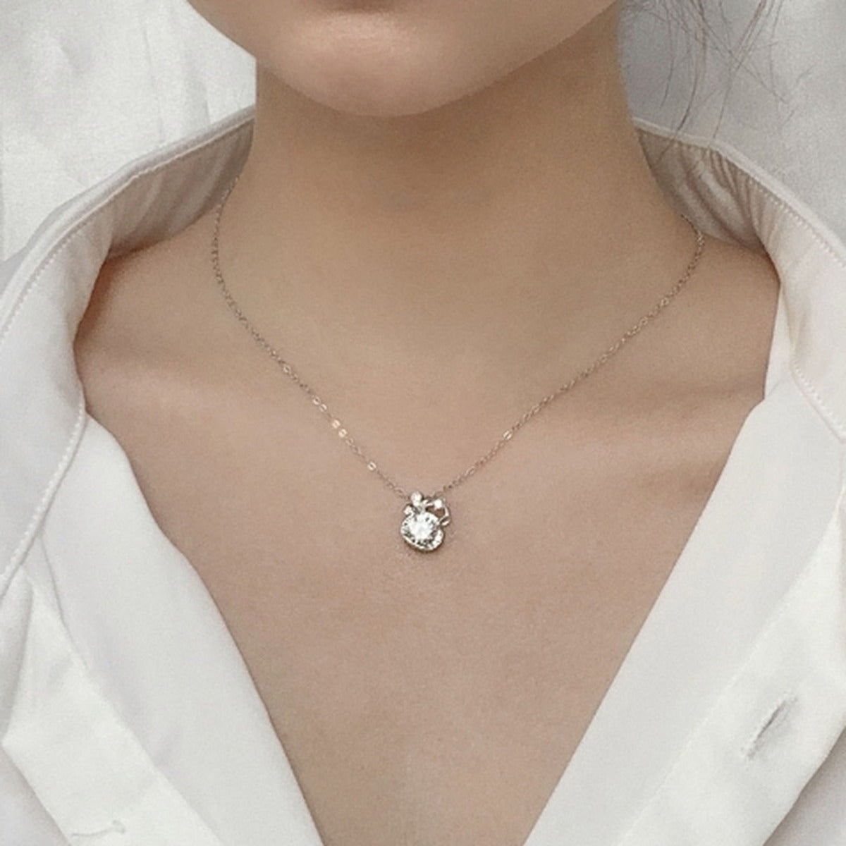 Gourd Round Moissanite Necklace with CZ in White Gold-Plated S925 sterling silver neckline model view showing pendant scale and chain length
