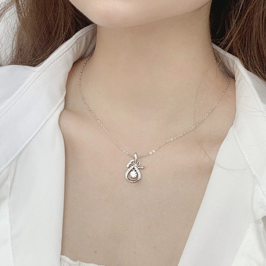 Magic Bag Round Moissanite Necklace with CZ in White Gold-Plated S925 sterling silver neckline model view showing pendant scale and chain length