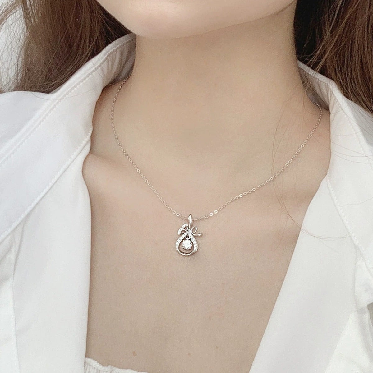 Magic Bag Round Moissanite Necklace with CZ in White Gold-Plated S925 sterling silver neckline model view showing pendant scale and chain length