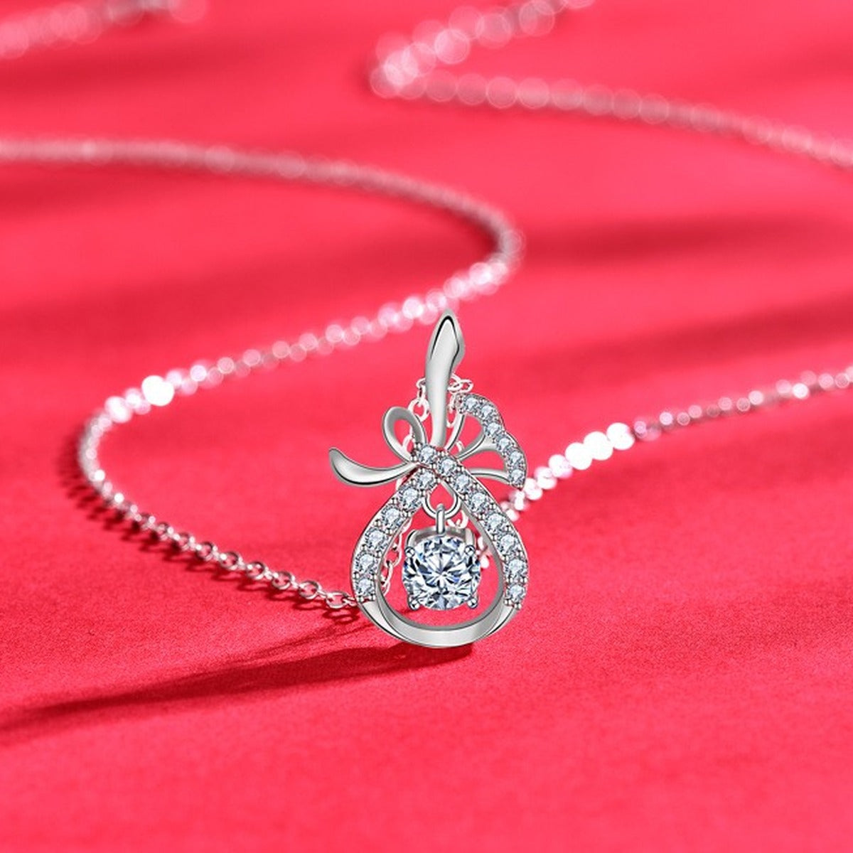 Magic Bag Round Moissanite Necklace with CZ in White Gold-Plated S925 sterling silver close-up product scene showing pendant setting