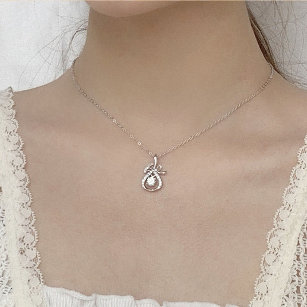 Magic Bag Round Moissanite Necklace with CZ in White Gold-Plated S925 sterling silver neckline model view showing pendant scale and chain length