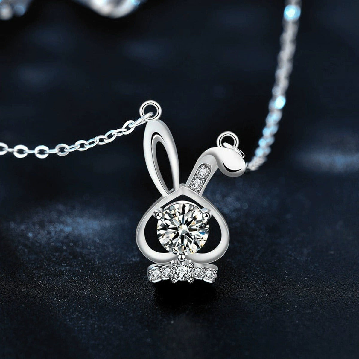 Bunny Round Moissanite Necklace with CZ in White Gold-Plated S925 sterling silver blue display scene showing chain and stone layout