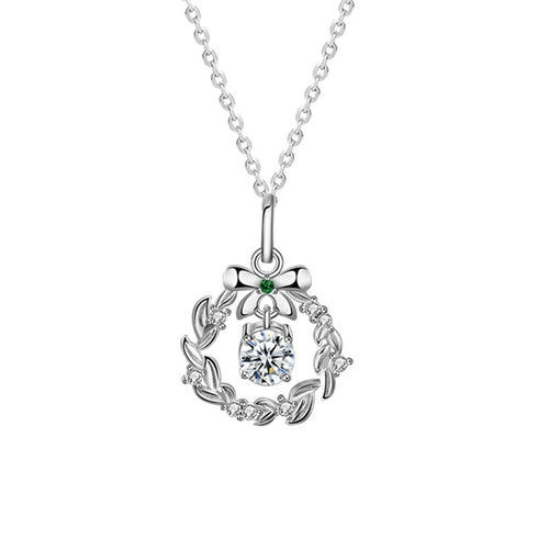 Christmas Wreath Round Moissanite Necklace with Green CZ in White Gold-Plated S925 sterling silver white background product photo showing christmas wreath pendant with round moissanite center and green CZ bow accent