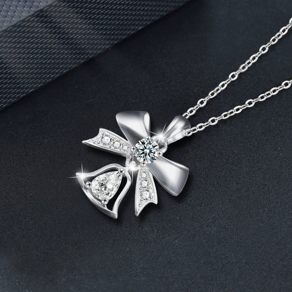Bowknot Bell Pear Cut Moissanite Necklace with CZ in White Gold-Plated S925 sterling silver blue display scene showing chain and stone layout