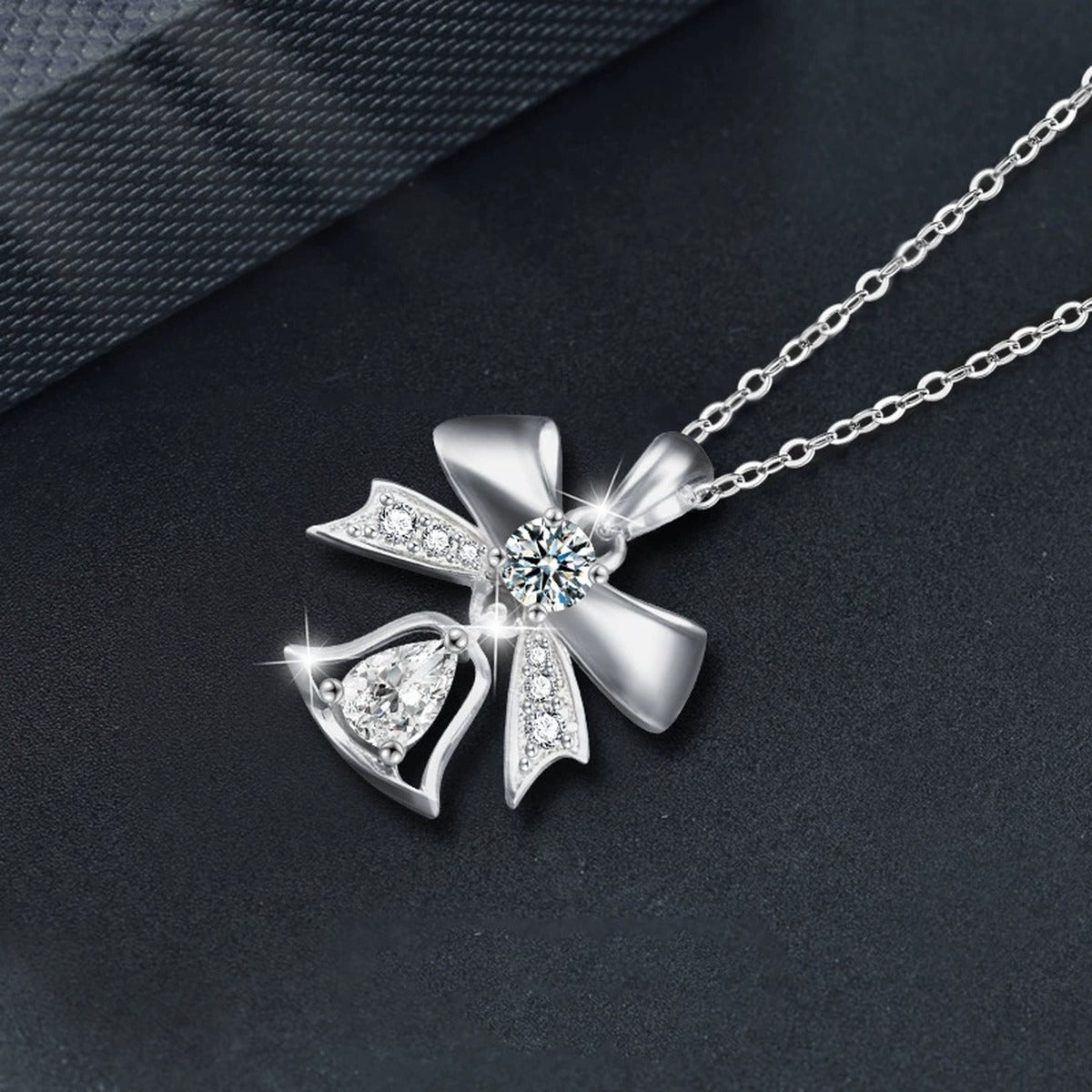 Bowknot Bell Pear Cut Moissanite Necklace with CZ in White Gold-Plated S925 sterling silver blue display scene showing chain and stone layout