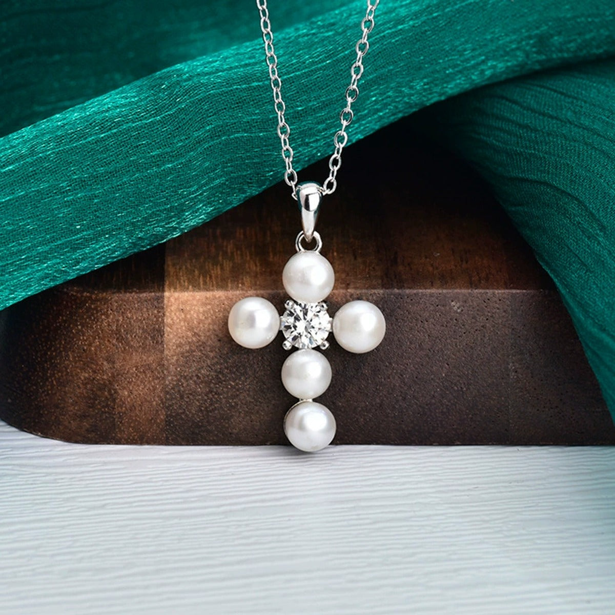 Pearl Cross Round Moissanite Necklace in White Gold-Plated S925 sterling silver close-up styled product scene showing pendant setting