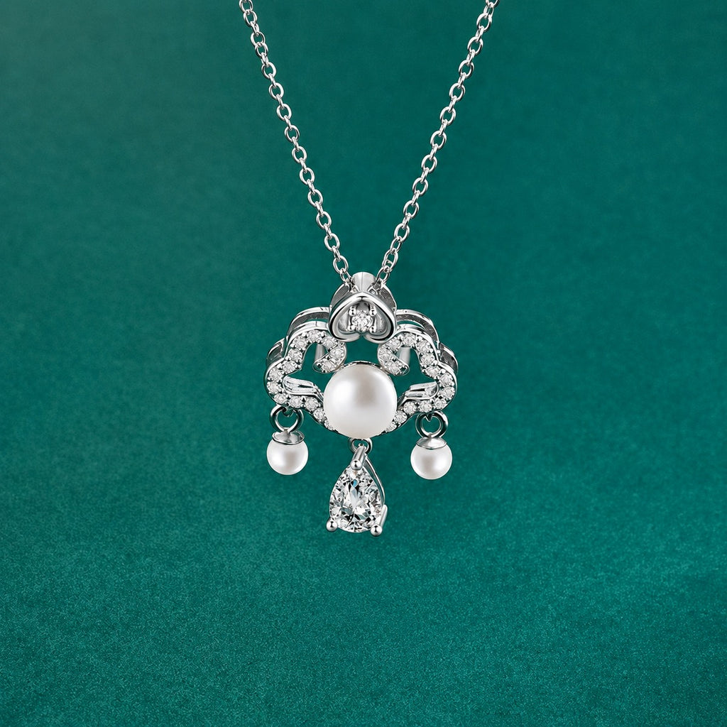 Ruyi Pear Cut Moissanite and Pearl Necklace with CZ in Gold-Plated S925 sterling silver close-up styled product scene showing pendant setting