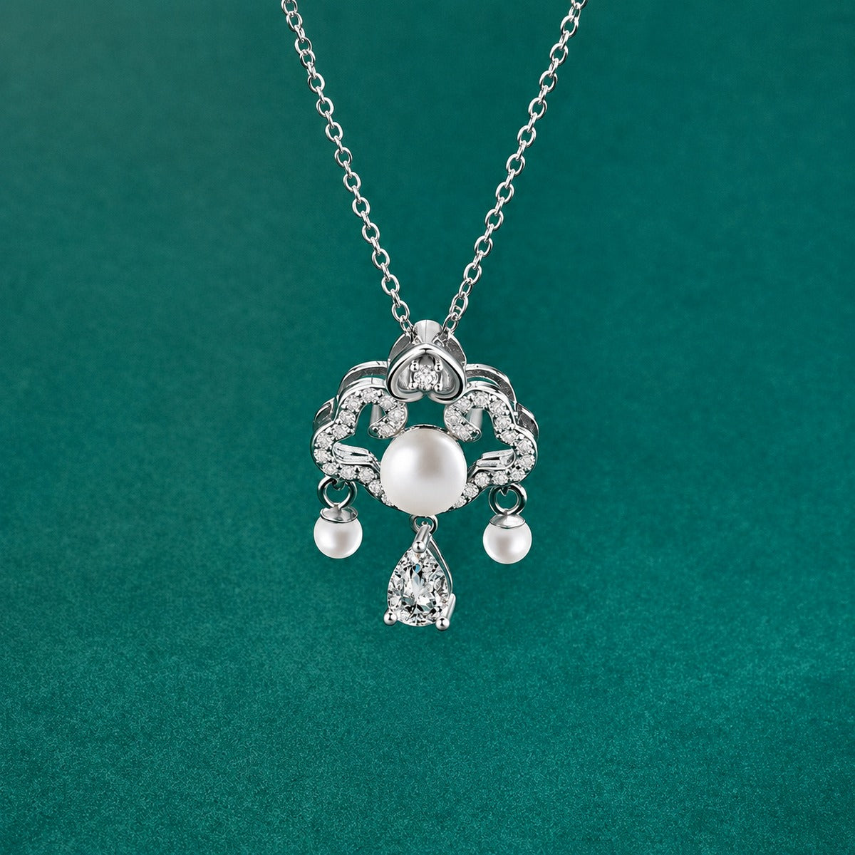 Ruyi Pear Cut Moissanite and Pearl Necklace with CZ in Gold-Plated S925 sterling silver close-up styled product scene showing pendant setting