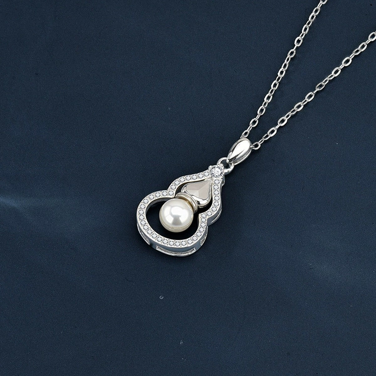 Pearl Gourd Round Moissanite Necklace with CZ in Gold-Plated S925 sterling silver angled necklace detail showing pendant profile
