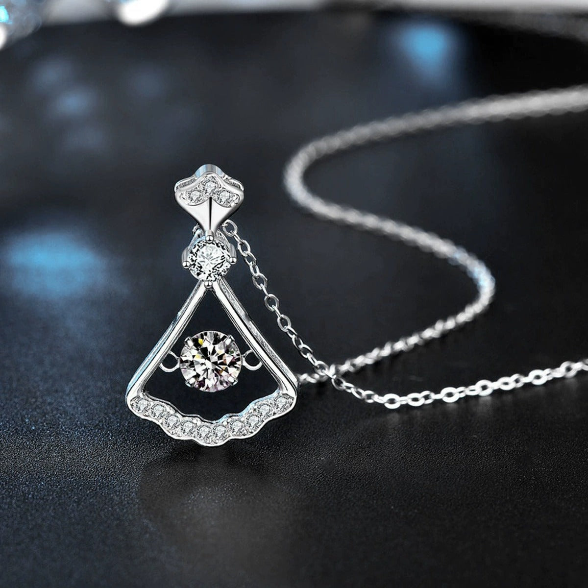 Dancing Skirt Round Moissanite Necklace with CZ in White Gold-Plated S925 sterling silver blue display scene showing chain and stone layout