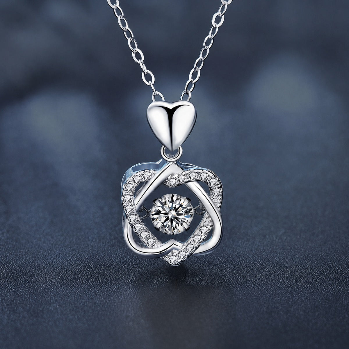 Interlaced Heart Round Moissanite Necklace with CZ in White Gold-Plated S925 sterling silver close-up styled product scene showing pendant setting