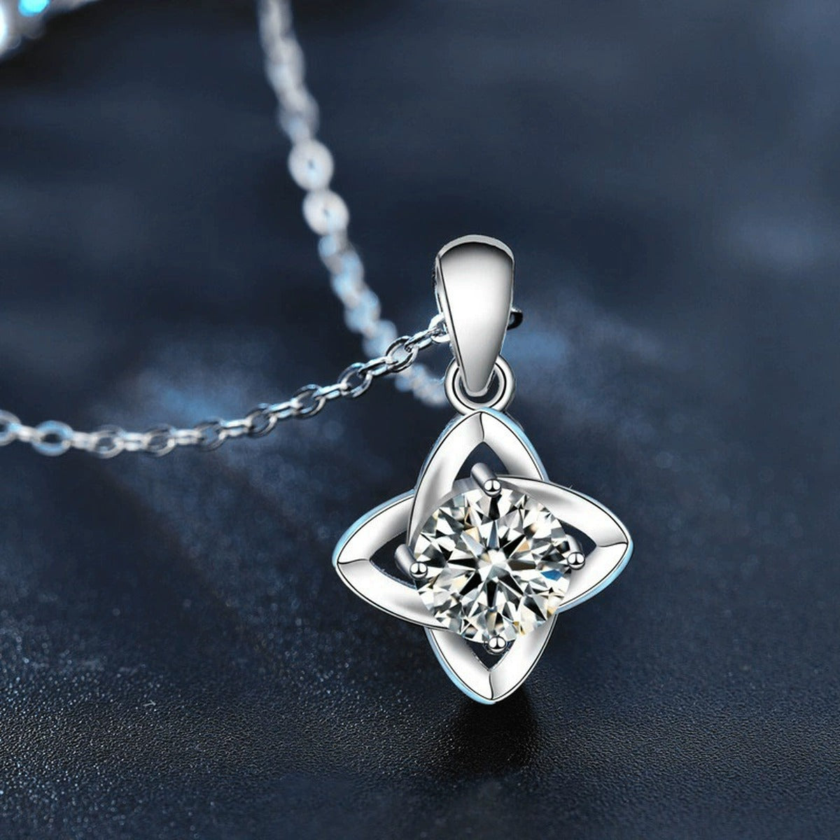 Four-Leaf Clover Round Moissanite Necklace in White Gold-Plated S925 sterling silver blue display scene showing chain and stone layout