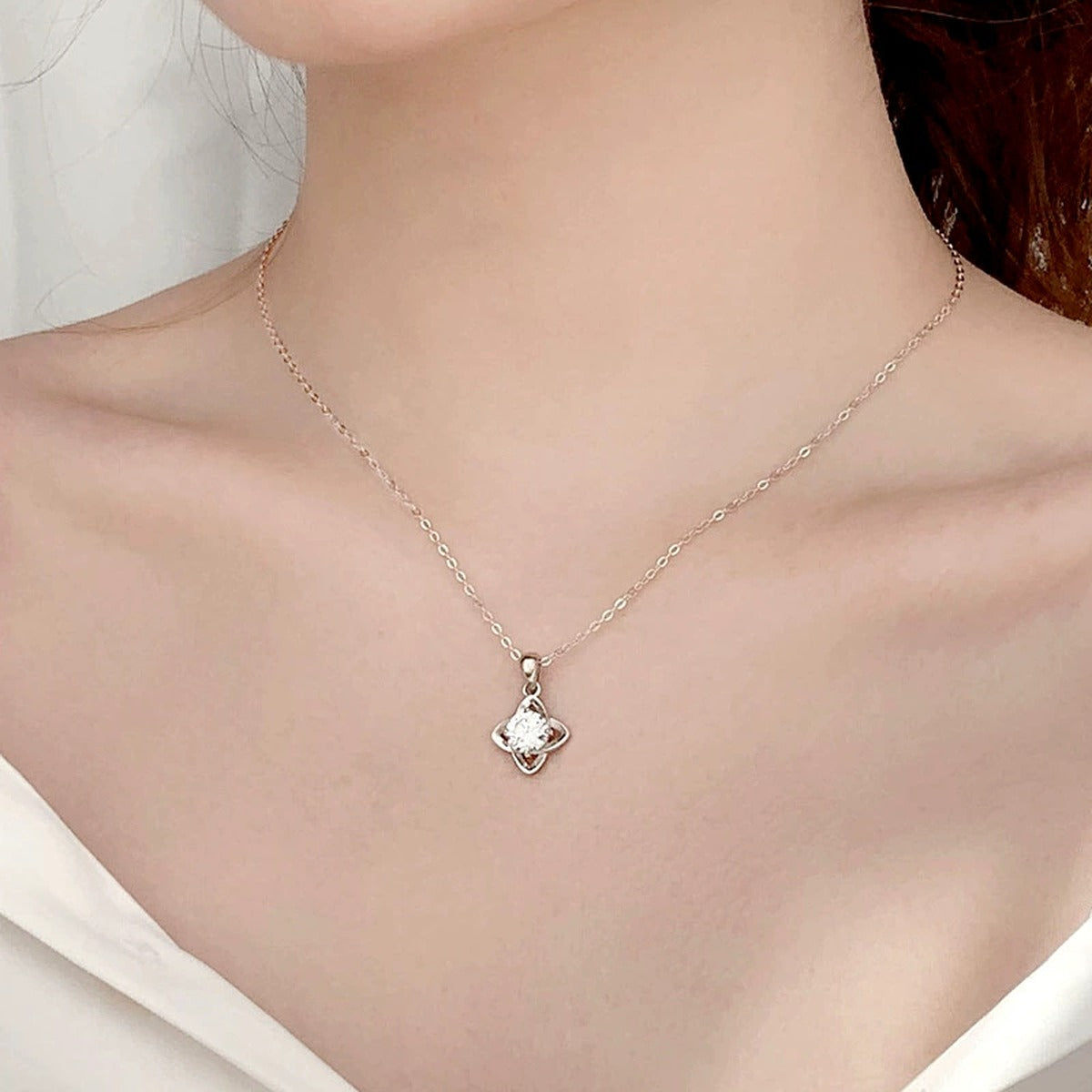 Four-Leaf Clover Round Moissanite Necklace in White Gold-Plated S925 sterling silver neckline model view showing pendant scale and chain length