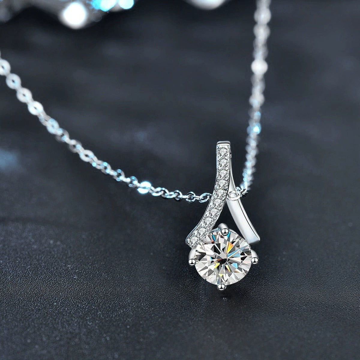 Curved Drop Round Moissanite Necklace with CZ in White Gold-Plated S925 sterling silver blue display scene showing chain and stone layout