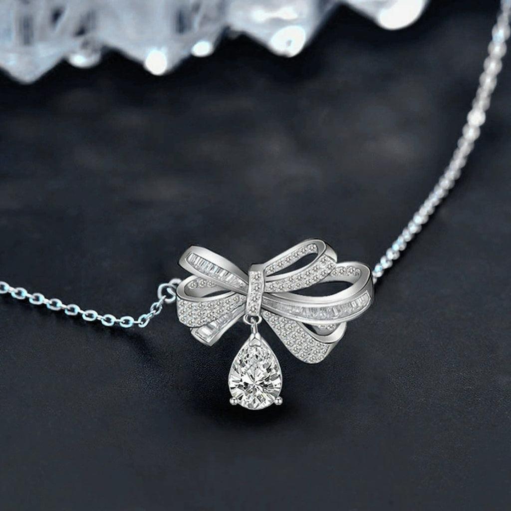 Bowknot Pear Moissanite Necklace with CZ in White Gold-Plated S925 sterling silver blue display scene showing chain and stone layout