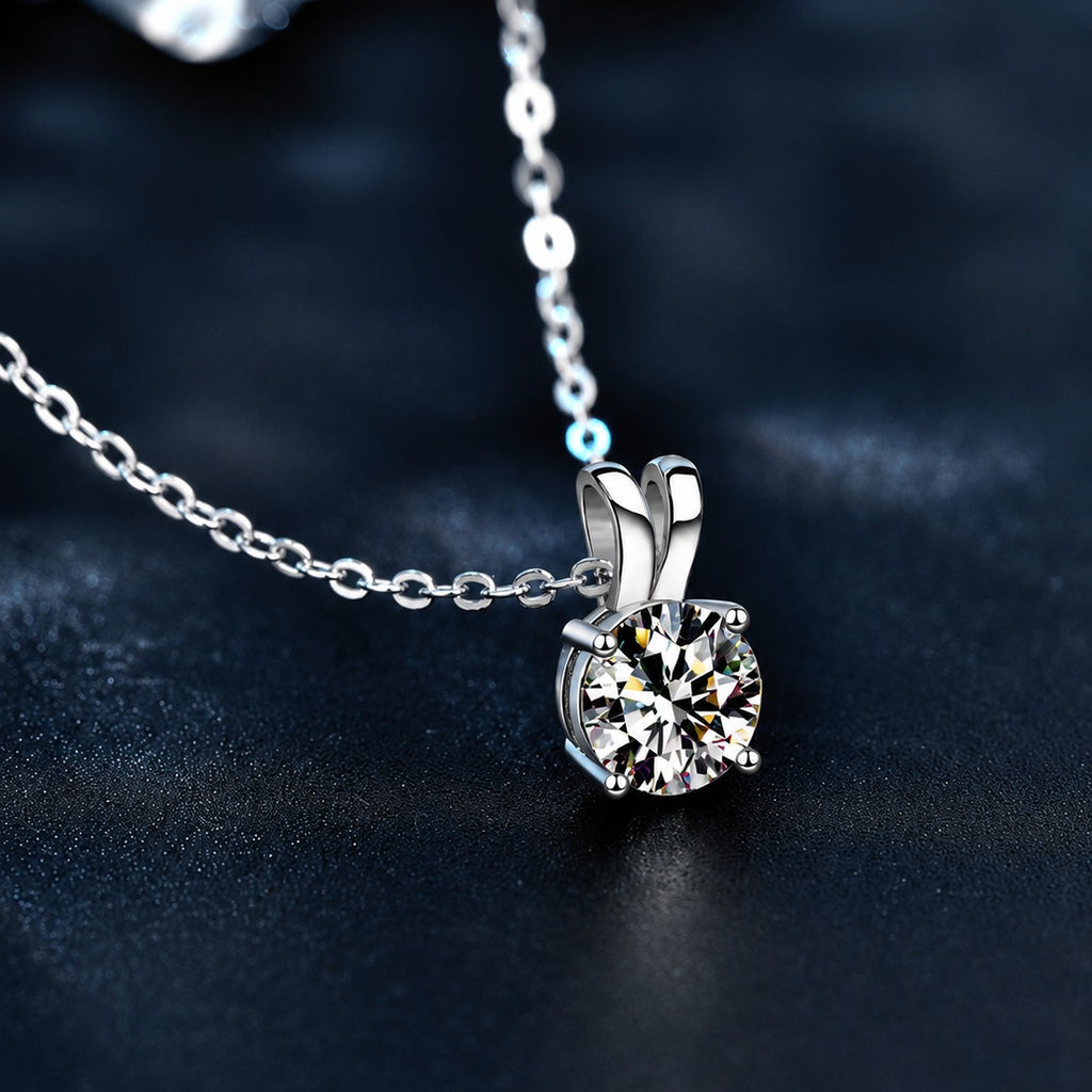 Four-Prong Round Moissanite Solitaire Necklace in Gold-Plated S925 sterling silver close-up styled product scene showing pendant setting