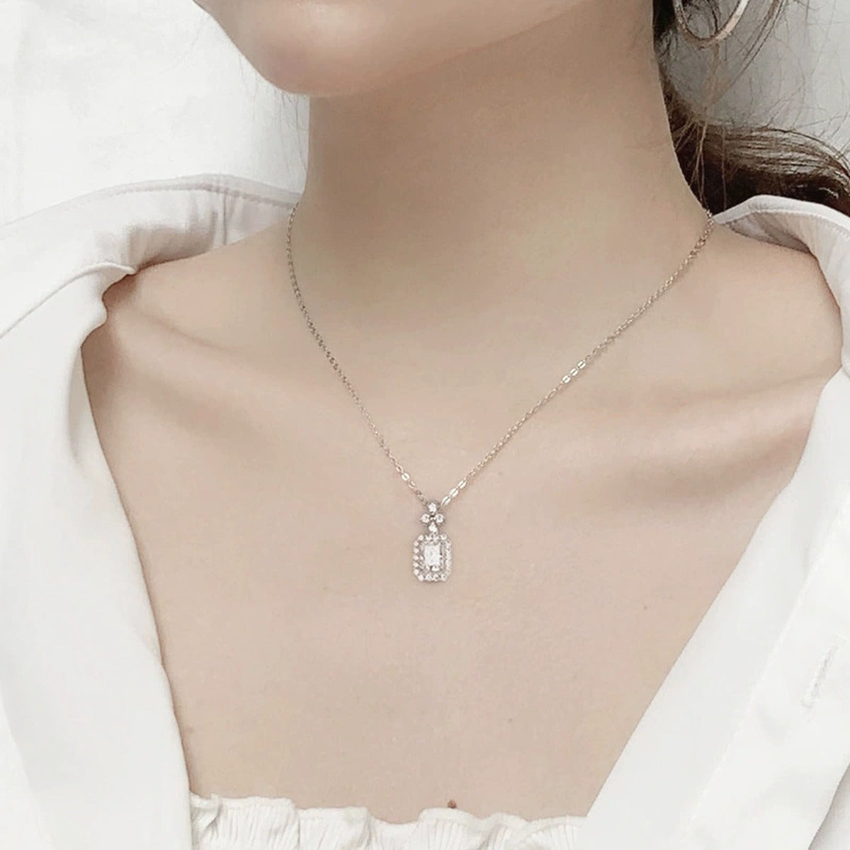 Radiant Cut Moissanite Halo Necklace with CZ in White Gold-Plated S925 sterling silver neckline model view showing pendant scale and chain length