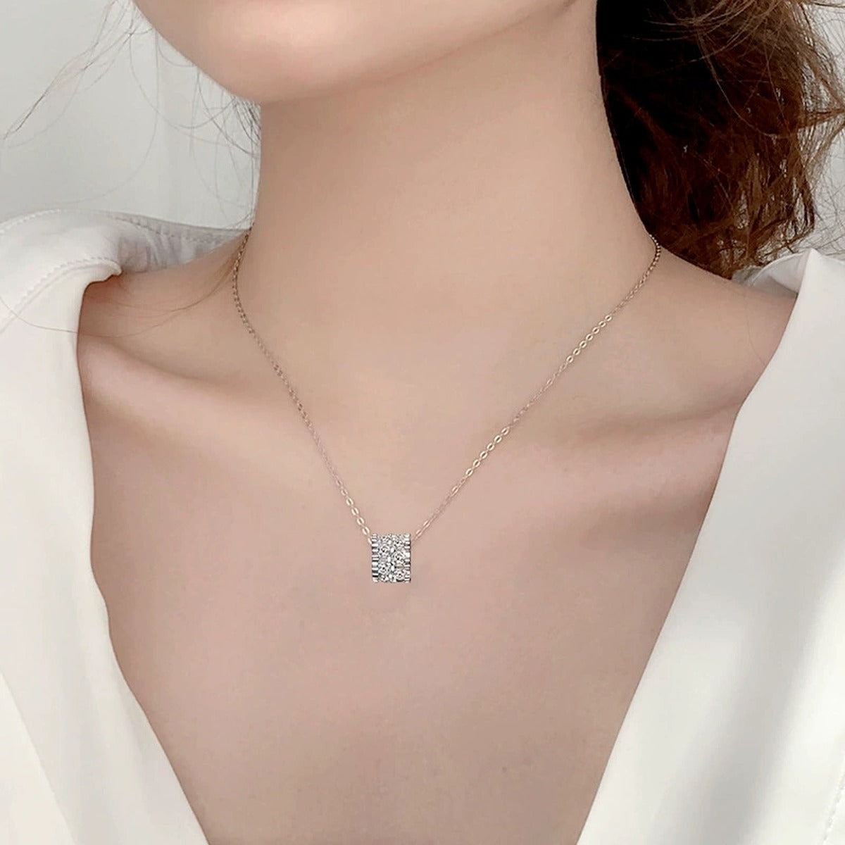 Round Wheel Moissanite Necklace with CZ in White Gold-Plated S925 sterling silver neckline model view showing pendant scale and chain length
