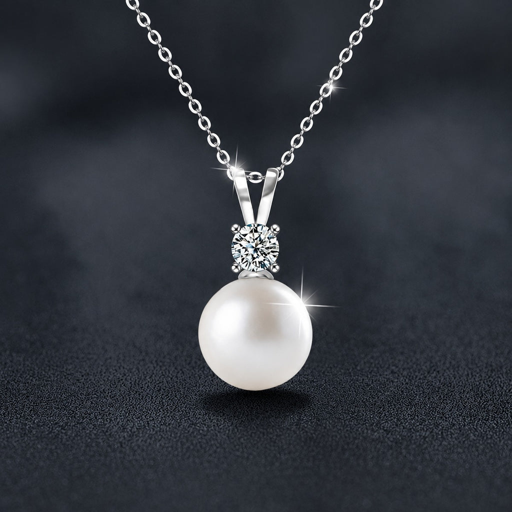 Round Moissanite and Pearl Drop Necklace in White Gold-Plated S925 sterling silver close-up styled product scene showing pendant setting