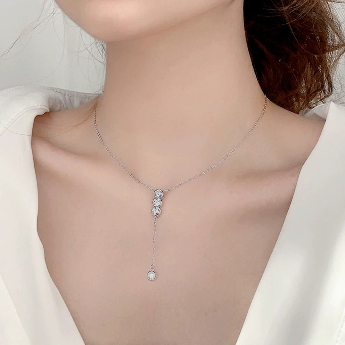 Tassel Bead Round Moissanite Necklace in White Gold-Plated S925 sterling silver neckline model view showing pendant scale and chain length