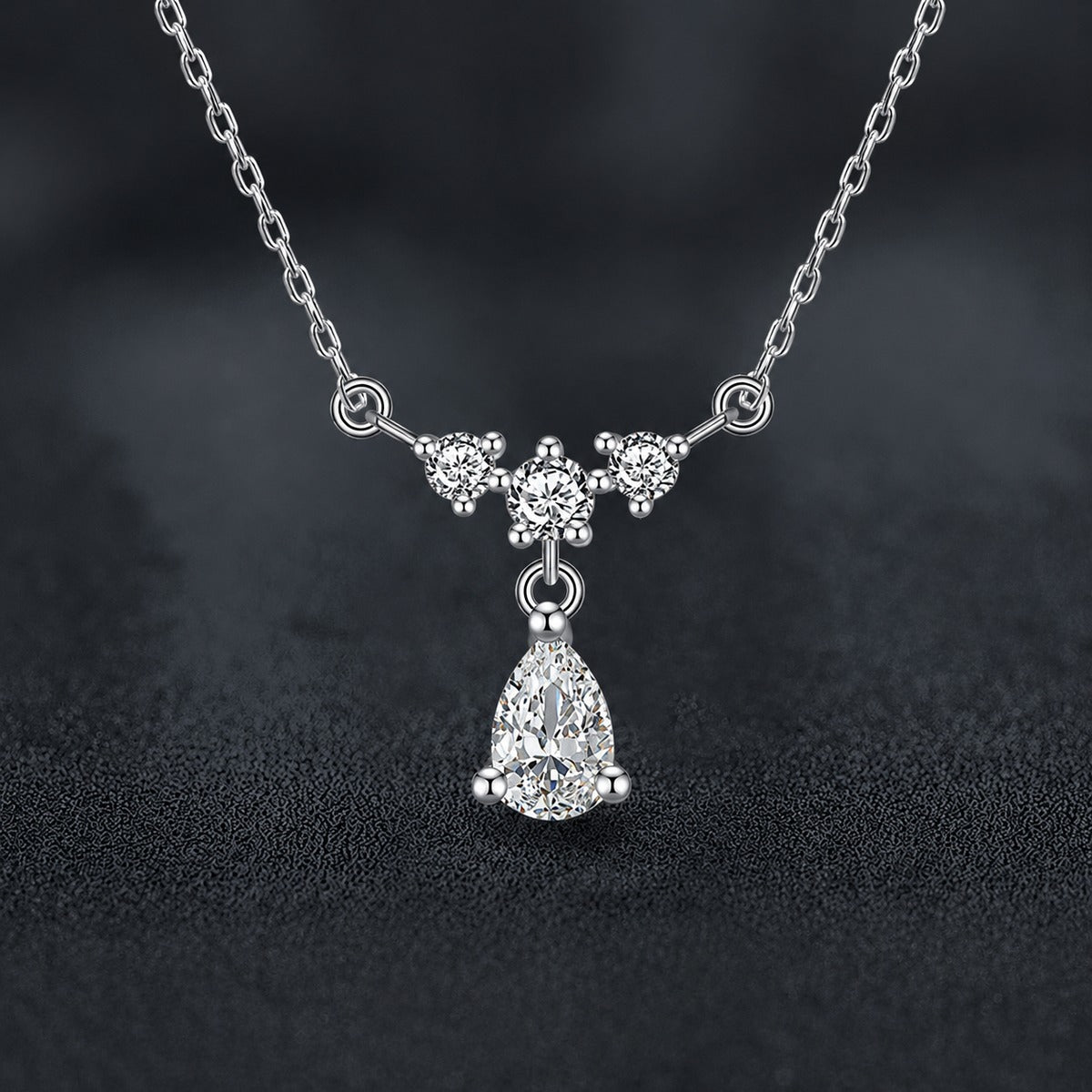 Pear Cut Teardrop Moissanite Necklace with CZ in White Gold-Plated S925 sterling silver close-up styled product scene showing pendant setting