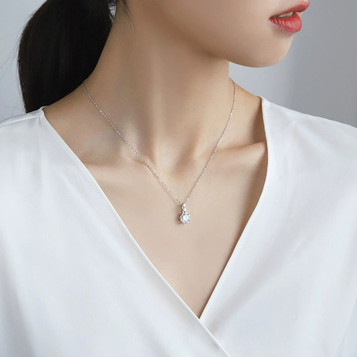 Snowflake Round Moissanite Necklace with CZ in White Gold-Plated S925 sterling silver neckline model view showing pendant scale and chain length