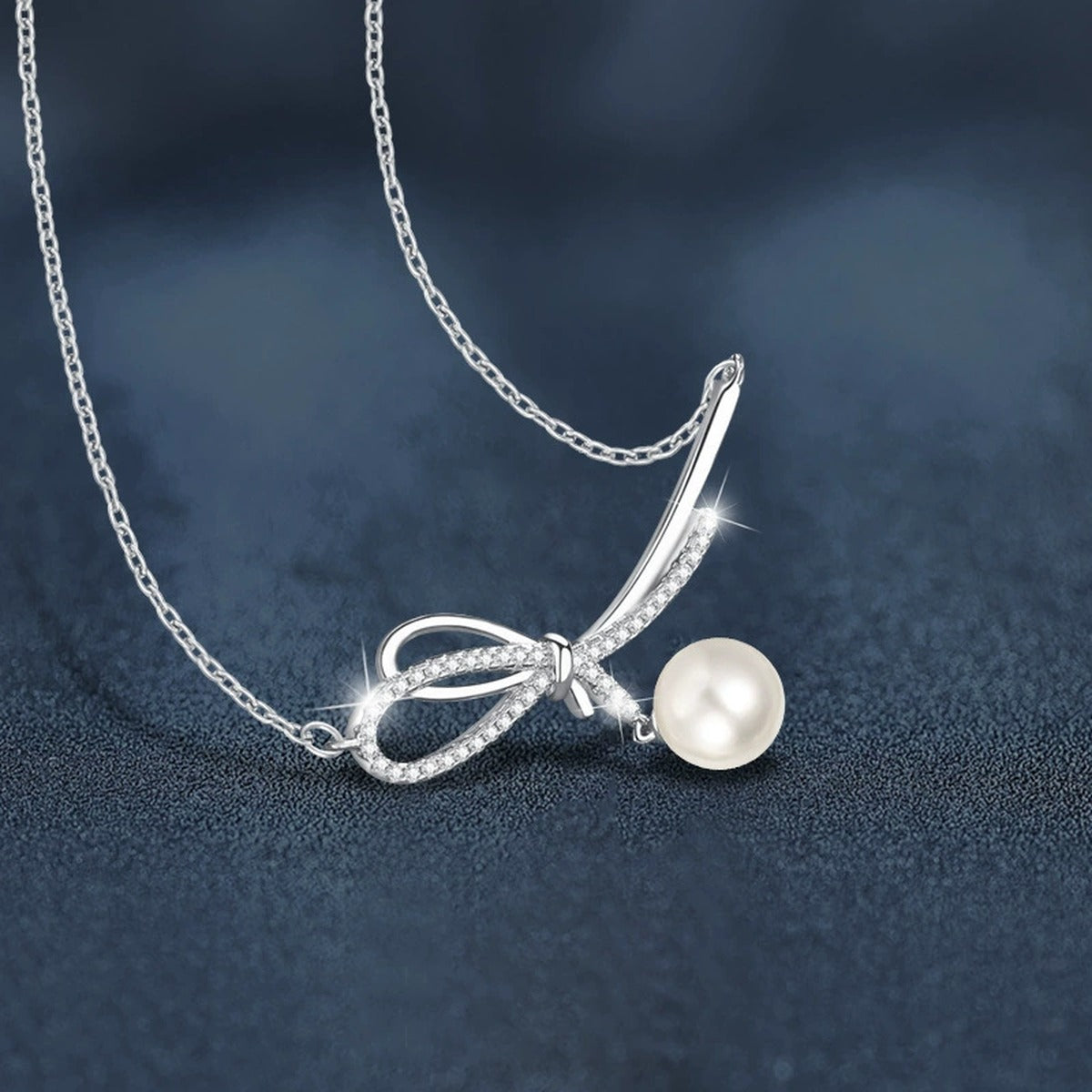 Bowknot Pearl and Moissanite Necklace in White Gold-Plated S925 sterling silver blue display scene showing chain and stone layout