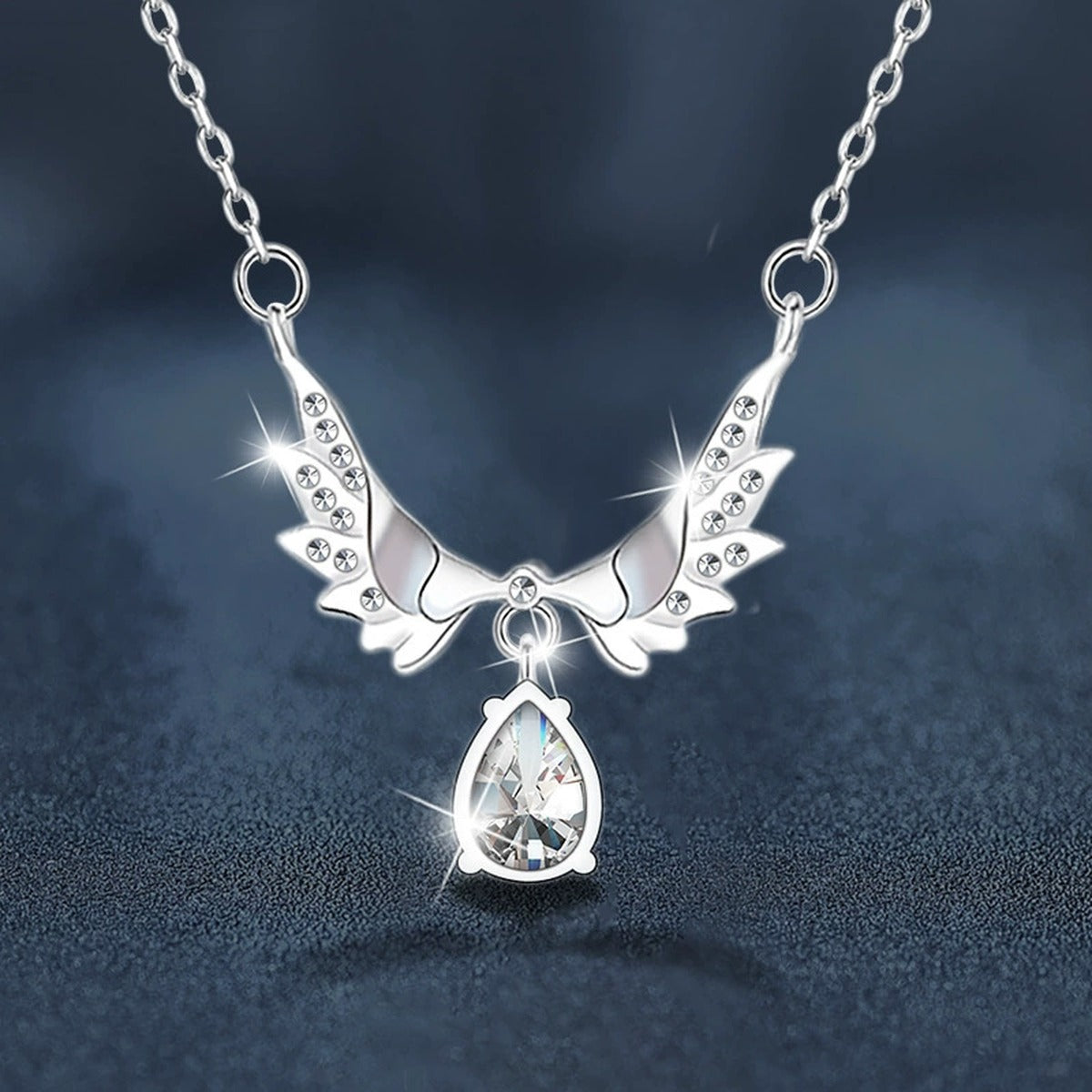 Angel Wing Pear Cut Moissanite Necklace with CZ in White Gold-Plated S925 sterling silver blue display scene showing chain and stone layout