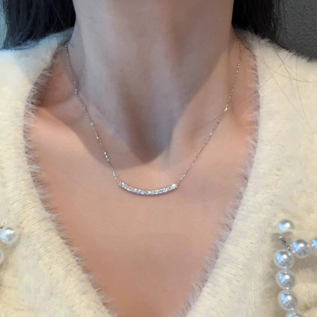 Curved Bar Round Moissanite Necklace in Gold-Plated S925 sterling silver additional worn styling view showing the pendant on the body