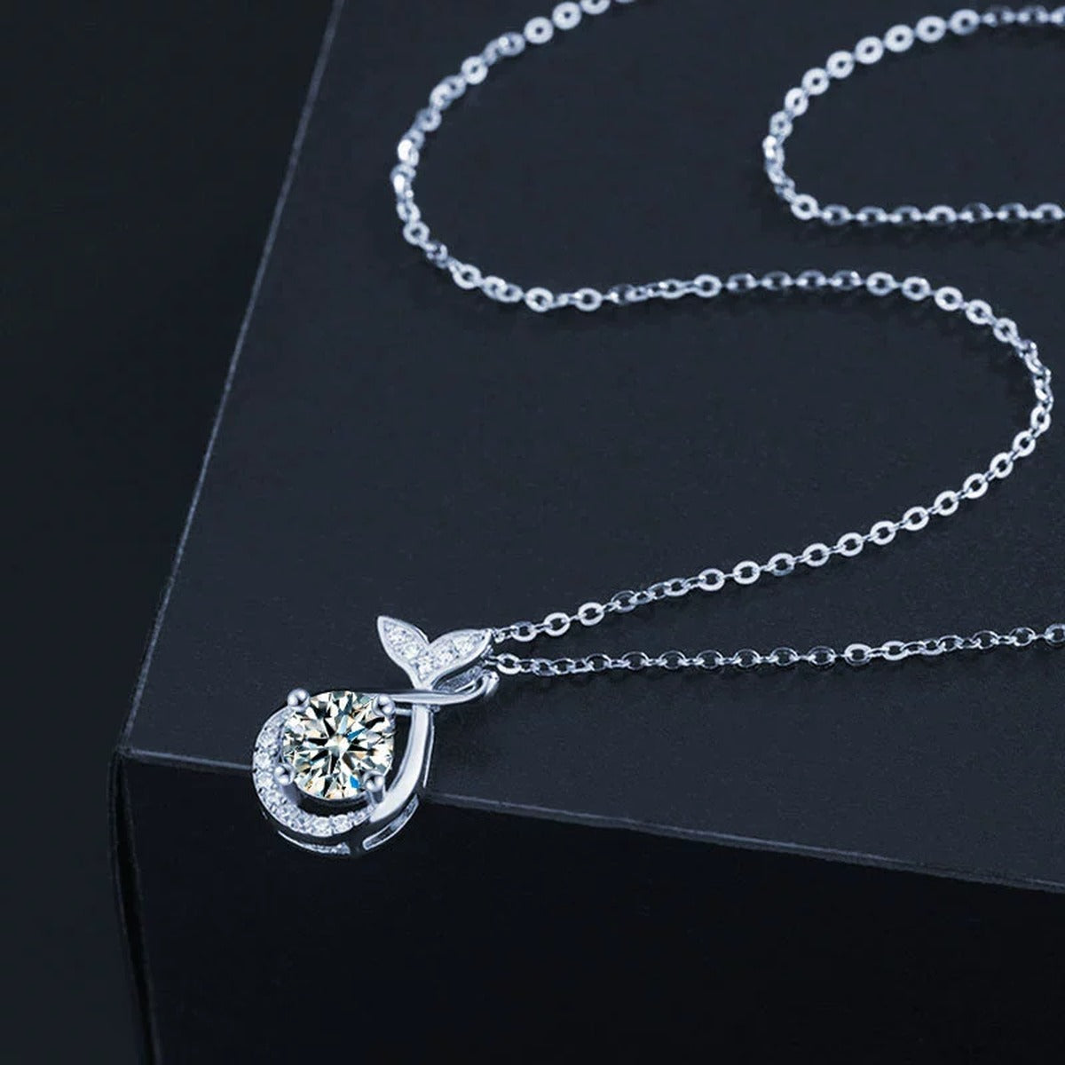 Whale Tail Round Moissanite Necklace with CZ in White Gold-Plated S925 sterling silver blue display scene showing chain and stone layout
