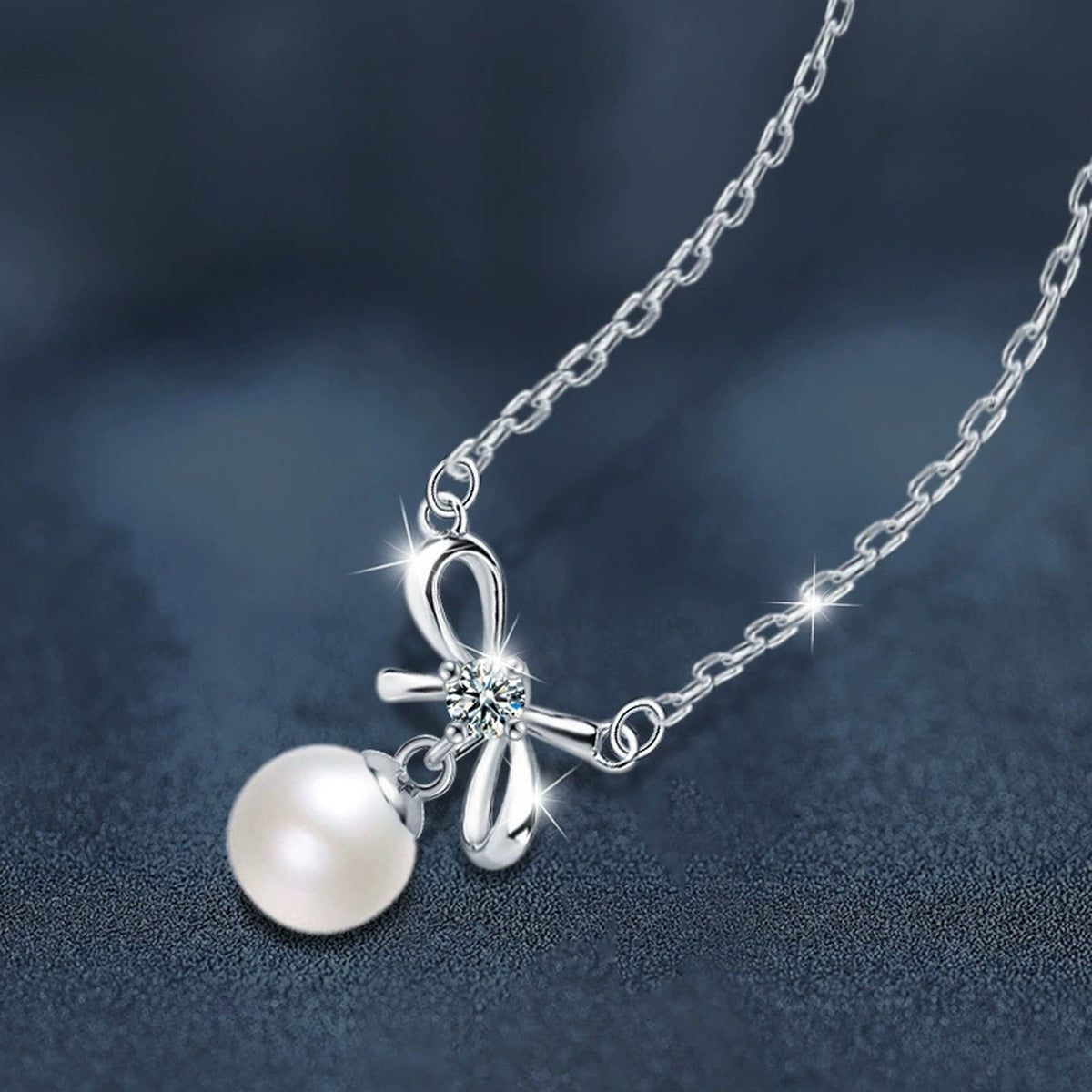 Bowknot Round Moissanite and Pearl Necklace in Gold-Plated S925 sterling silver display scene showing chain and stone layout