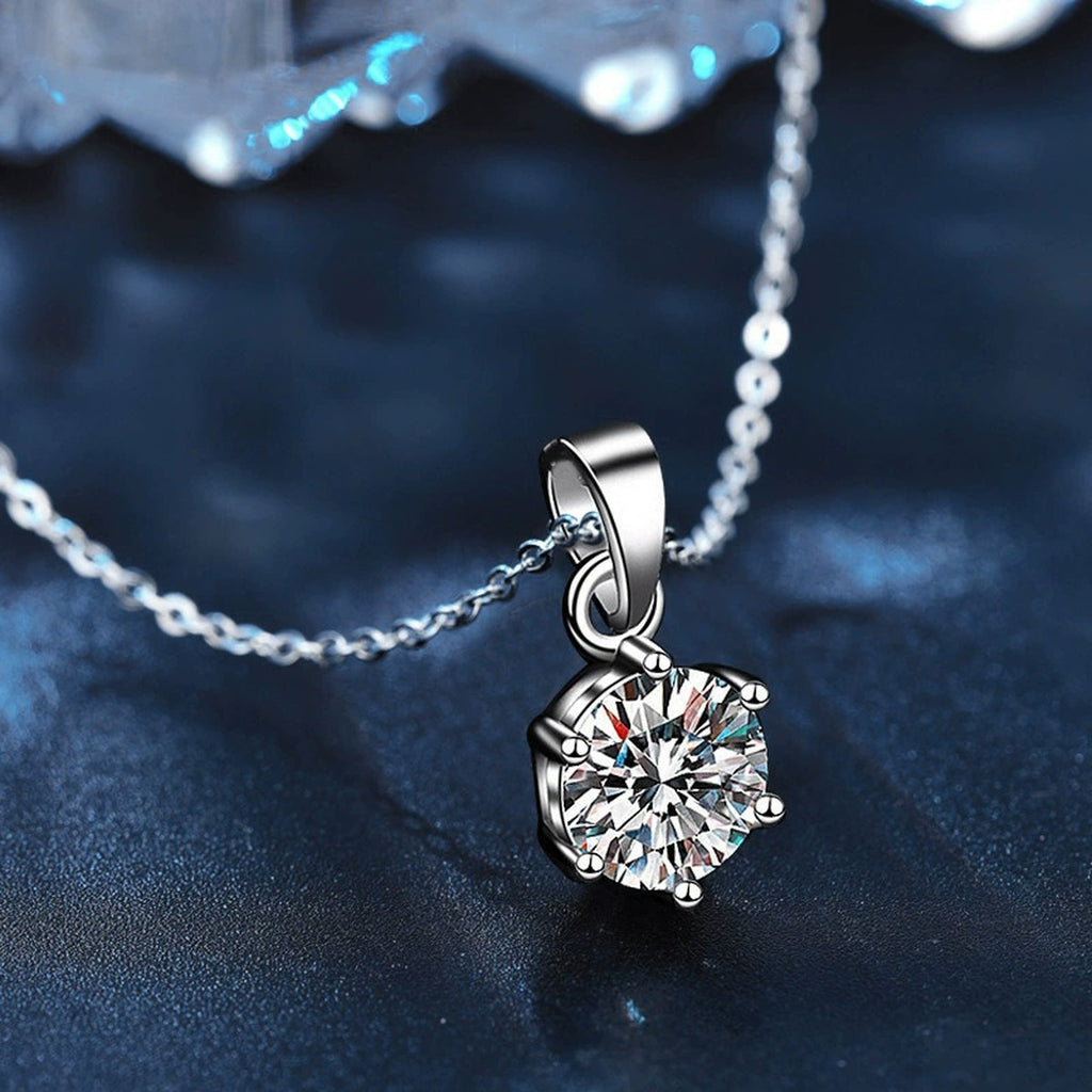 Six-Prong Round Moissanite Necklace in Gold-Plated S925 sterling silver blue display scene showing chain and stone layout