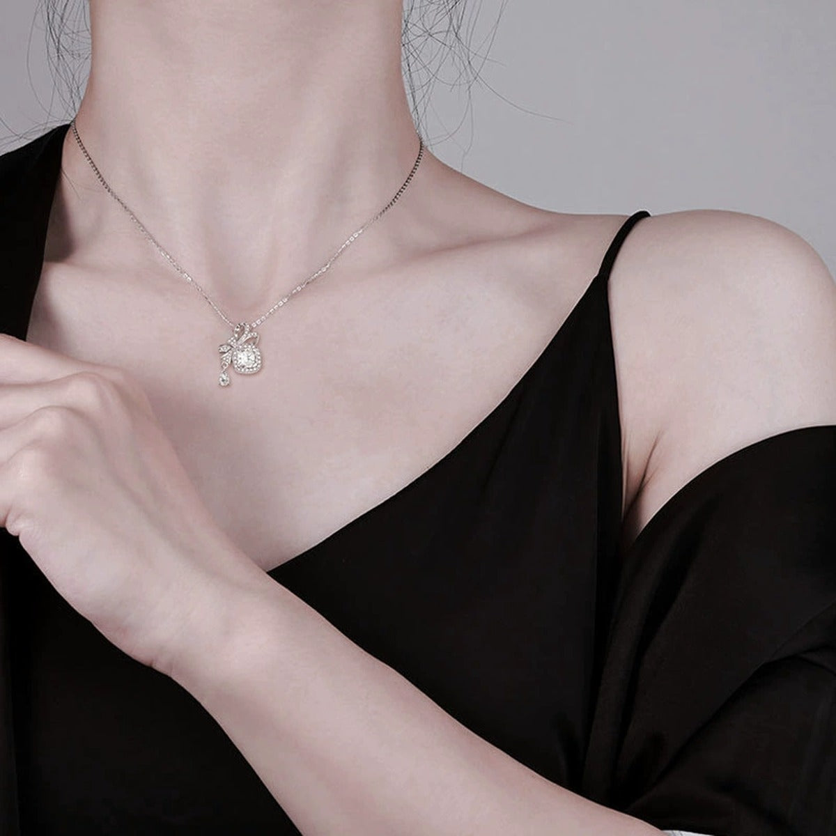 Bowknot Cushion Cut Moissanite Necklace with CZ in White Gold-Plated S925 sterling silver neckline model view showing pendant scale and chain length