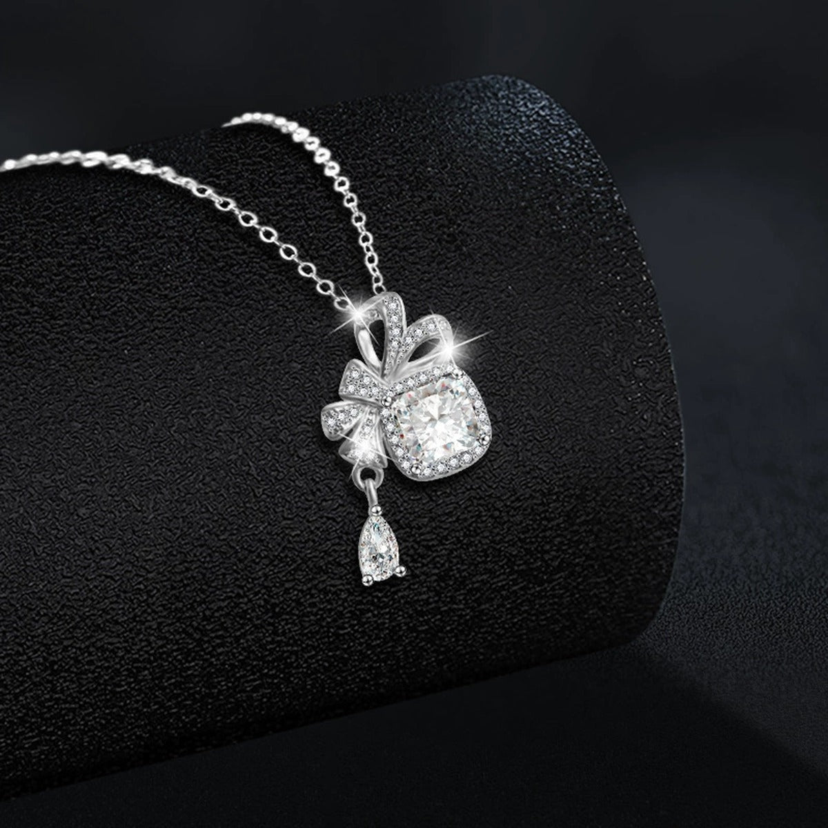 Bowknot Cushion Cut Moissanite Necklace with CZ in White Gold-Plated S925 sterling silver blue display scene showing chain and stone layout