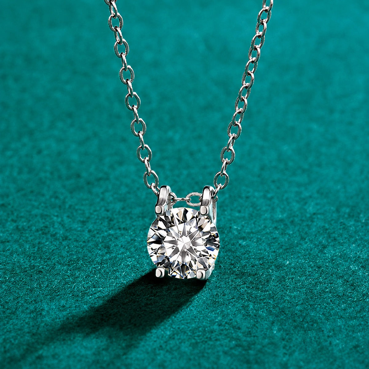 Round Moissanite Solitaire Necklace in Gold-Plated S925 sterling silver close-up styled product scene showing pendant setting