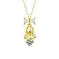 Bow Bell Round Moissanite Necklace with CZ in Gold-Plated S925 sterling silver white background product photo showing bow and bell pendant with a small round moissanite and CZ accents