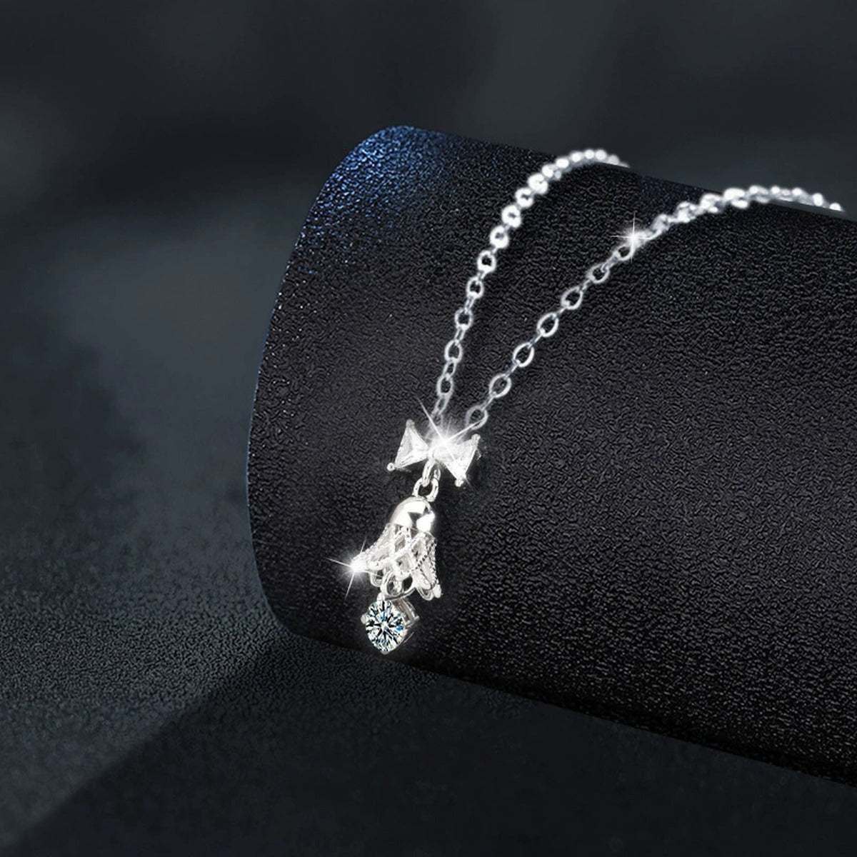 Bow Bell Round Moissanite Necklace with CZ in Gold-Plated S925 sterling silver close-up product scene showing stone setting