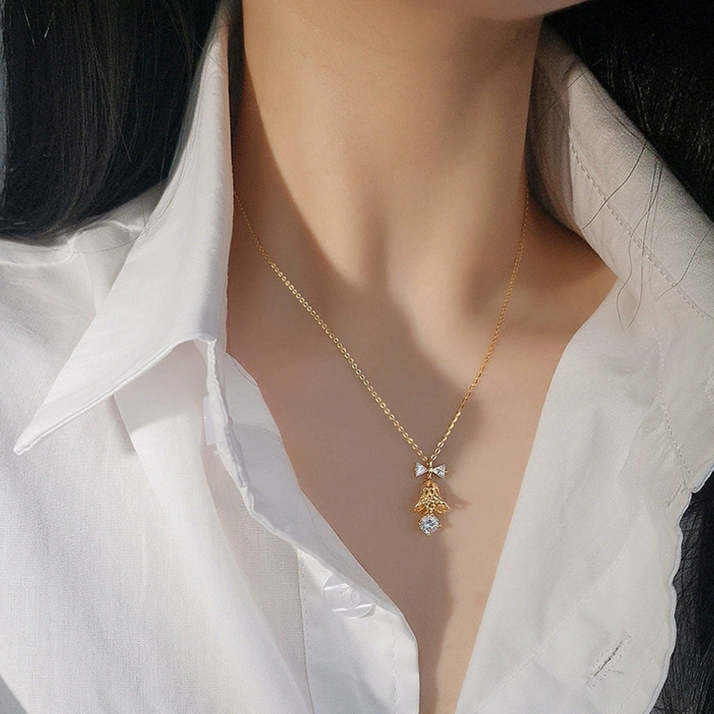 Bow Bell Round Moissanite Necklace with CZ in Gold-Plated S925 sterling silver neckline model view showing pendant scale and chain length