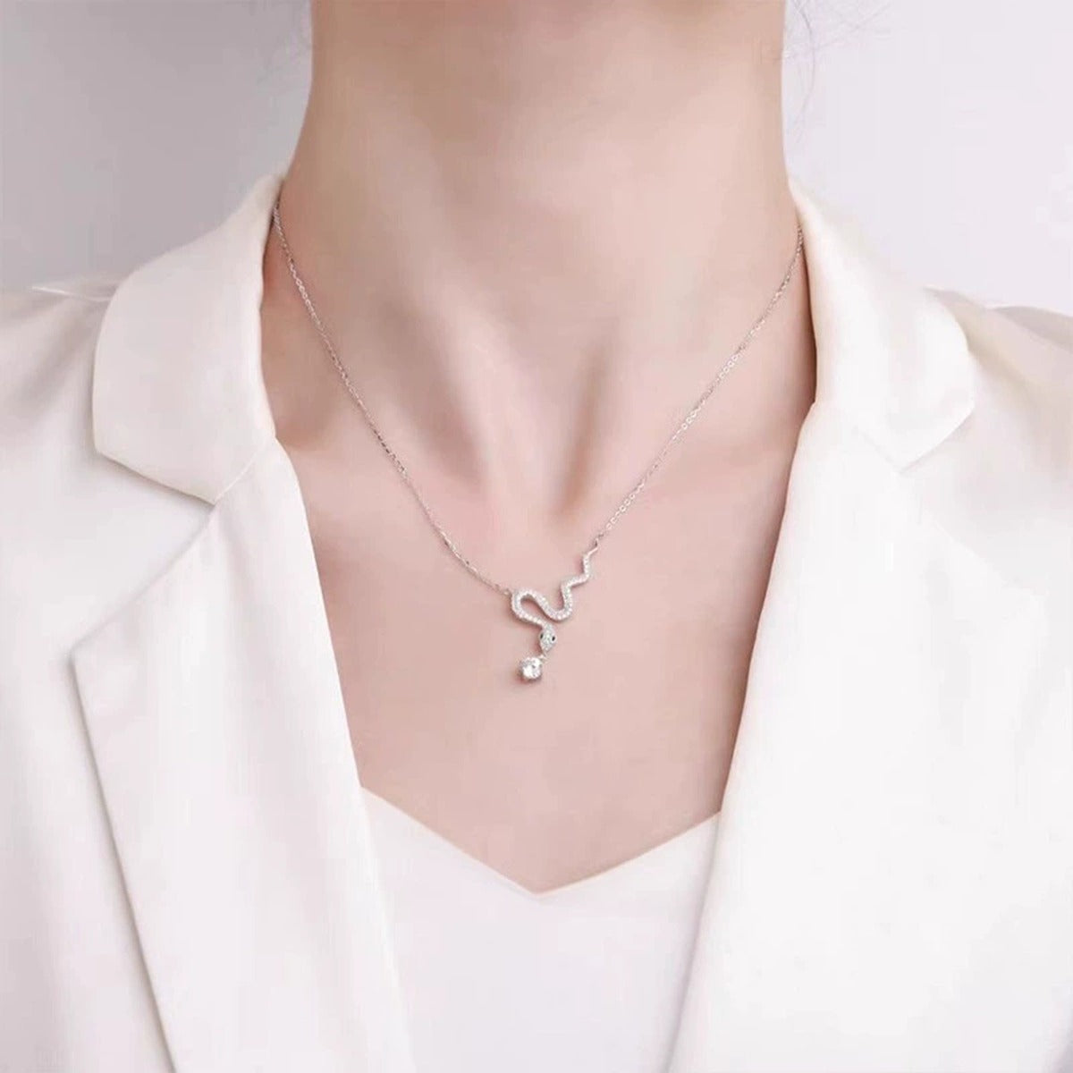 Snake Round Moissanite Necklace with CZ in White Gold-Plated S925 sterling silver neckline model view showing pendant scale and chain length