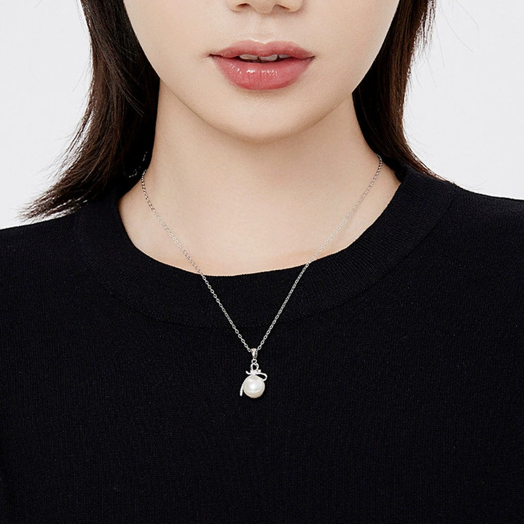 Bowknot Pearl Heart Cut Moissanite Necklace with CZ in Gold-Plated S925 sterling silver neckline model view showing pendant scale and chain length