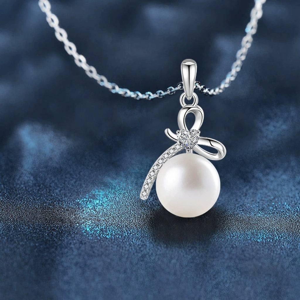 Bowknot Pearl Heart Cut Moissanite Necklace with CZ in Gold-Plated S925 sterling silver close-up product scene showing stone setting