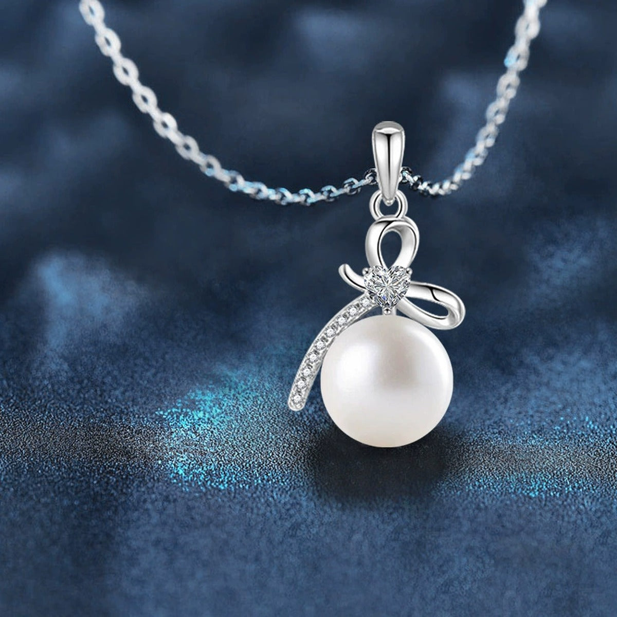 Bowknot Pearl Heart Cut Moissanite Necklace with CZ in Gold-Plated S925 sterling silver close-up product scene showing stone setting