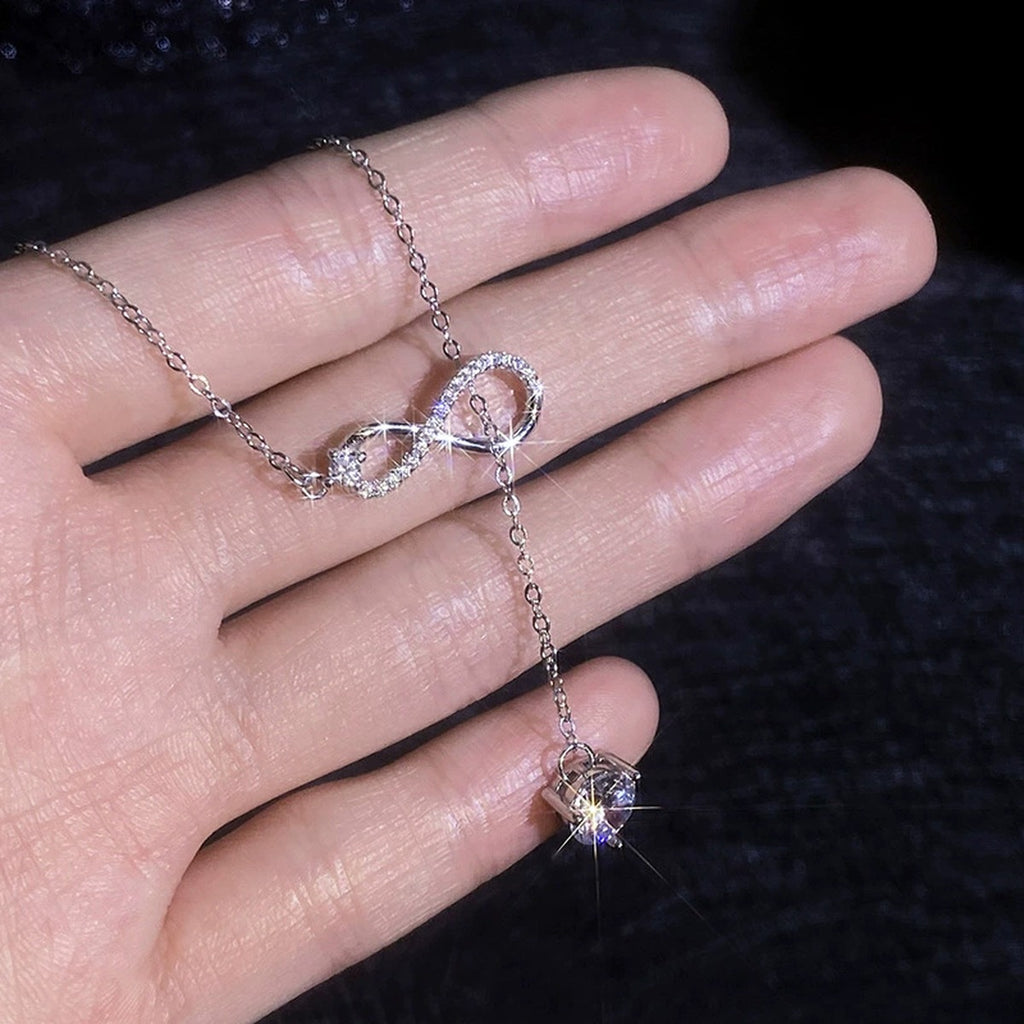 Infinity Drop Round Moissanite Necklace with CZ in Gold-Plated S925 sterling silver additional worn styling view showing the pendant on the body