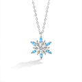 Blue CZ Snowflake Moissanite Necklace in White Gold-Plated S925 sterling silver white background front product view showing a snowflake composed of round moissanite and blue CZ points