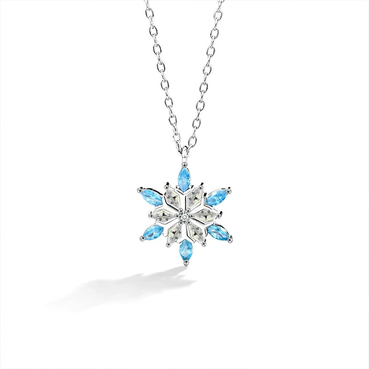 Blue CZ Snowflake Moissanite Necklace in White Gold-Plated S925 sterling silver white background front product view showing a snowflake composed of round moissanite and blue CZ points