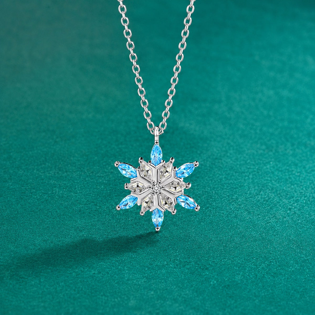Blue CZ Snowflake Moissanite Necklace in White Gold-Plated S925 sterling silver close-up styled product scene showing pendant setting
