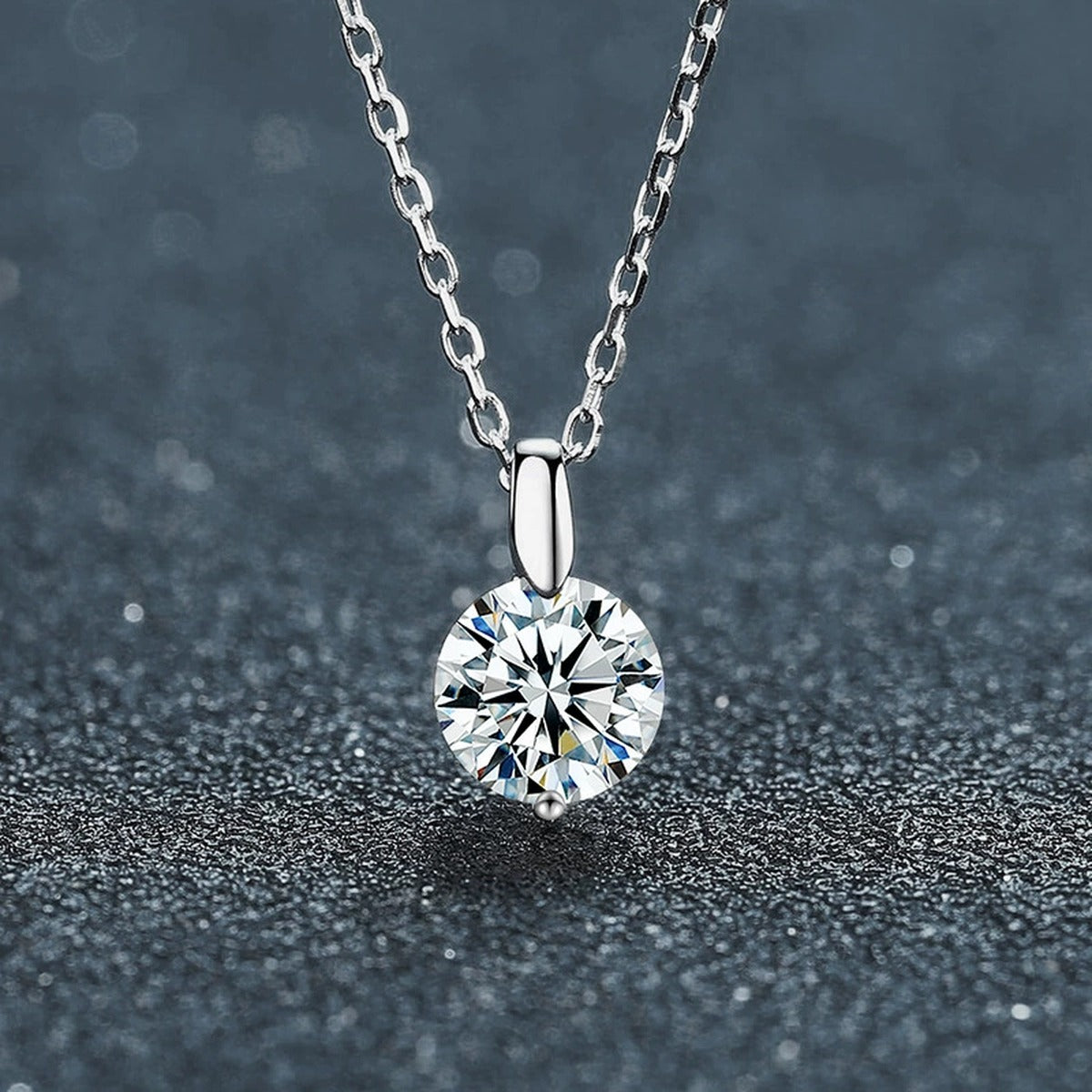 Six-Prong Round Moissanite Solitaire Necklace in Gold-Plated S925 sterling silver close-up styled product scene showing pendant setting