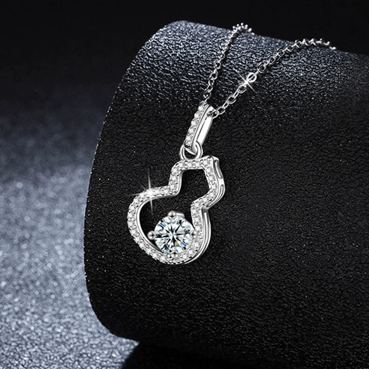 Gourd Round Moissanite Necklace with CZ in White Gold-Plated S925 sterling silver close-up styled product scene showing pendant setting