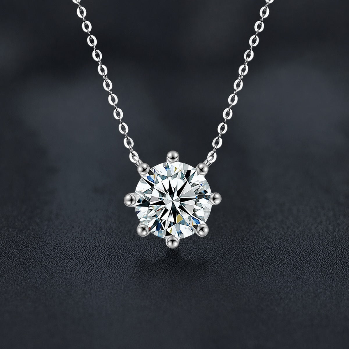 Six-Prong Round Moissanite Solitaire Necklace in Gold-Plated S925 sterling silver close-up styled product scene showing pendant setting