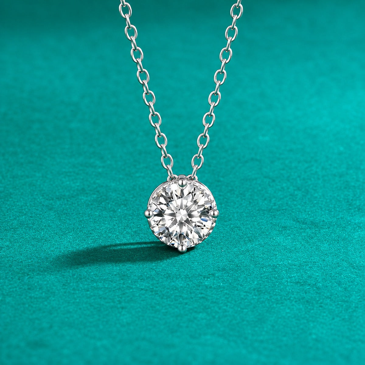 Four-Prong Round Moissanite Solitaire Necklace in Gold-Plated S925 sterling silver close-up styled product scene showing pendant setting
